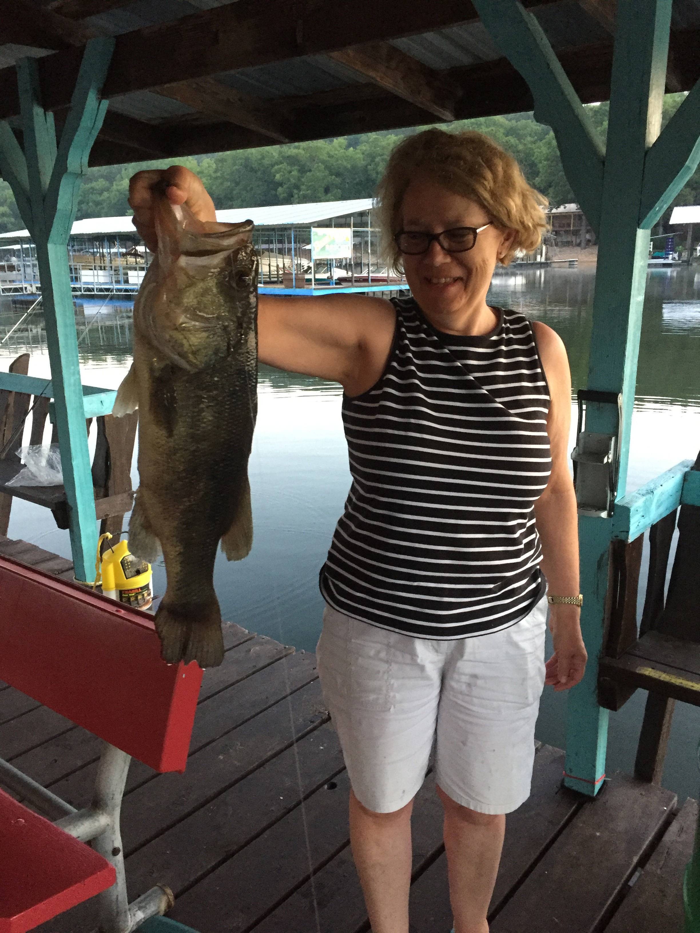 Large bass caught on fishing dock